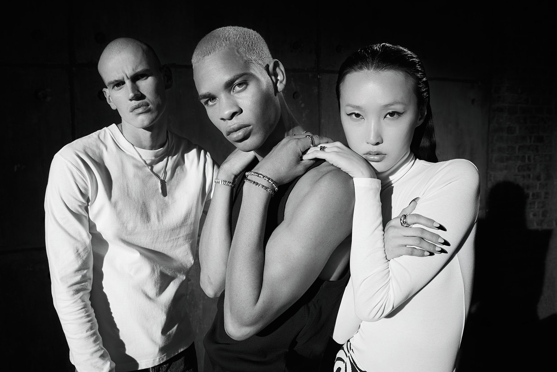 Korean model Shin Joo, Brazilian model Andrey Costa and Swiss model Noah Gamma portrayed by David Hatters for Zancan Gioielli. A strong black and white photo with hard light to enhance contrast and shadows.